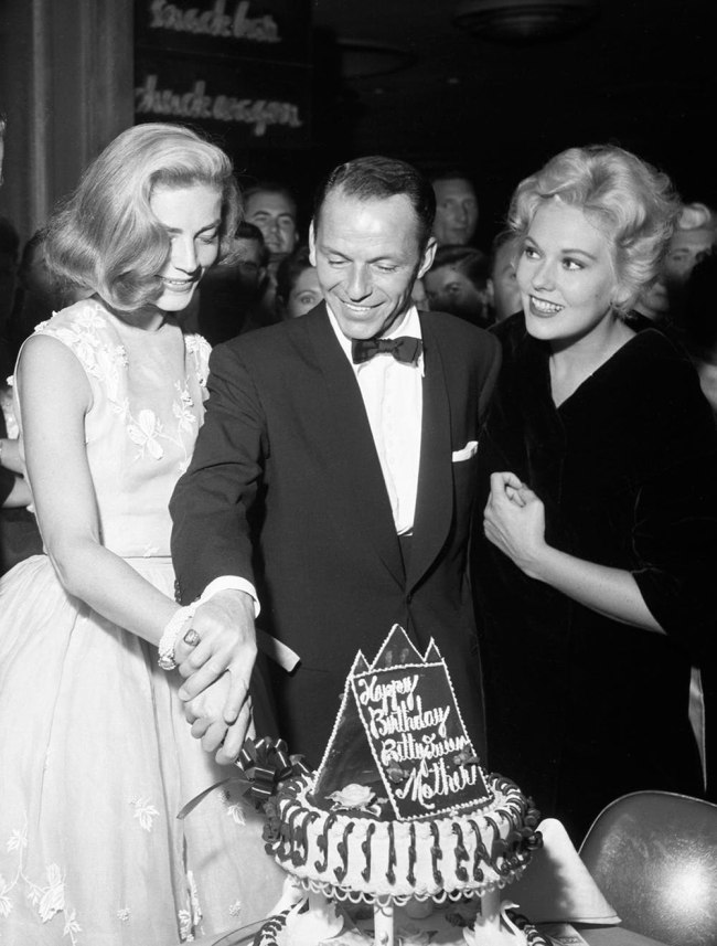 black and white photo of people celebrating a birthday